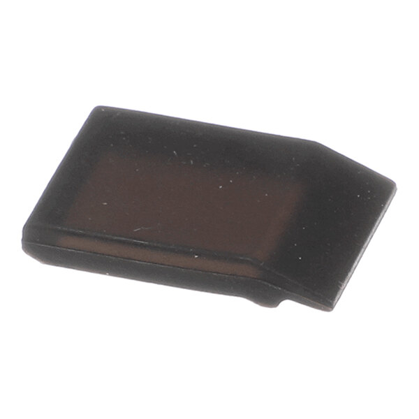 A small, flat, black, rectangular object with slightly angled edges, likely made of rubber or plastic.
