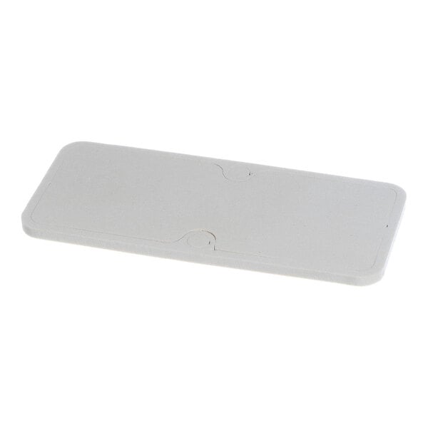 A rectangular, flat, light-colored gasket with rounded corners and a subtle groove pattern on its surface.