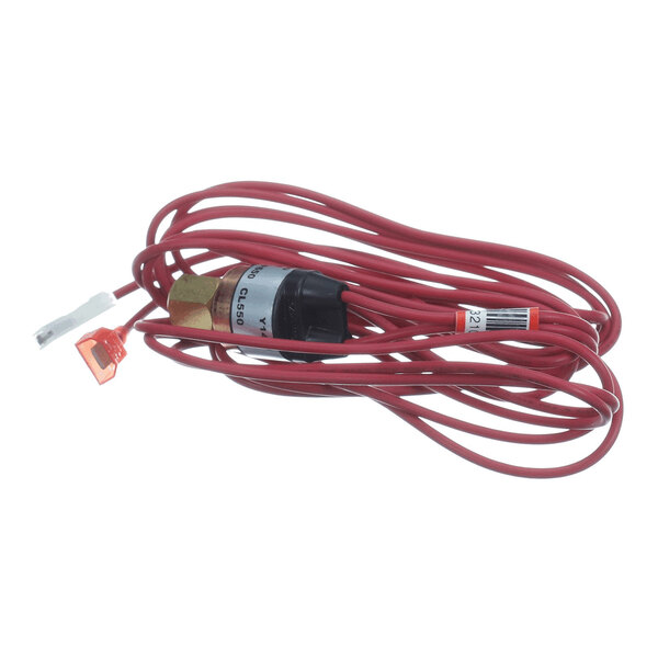 A coiled red electrical wire with a brass and black component attached, featuring connectors at the ends.