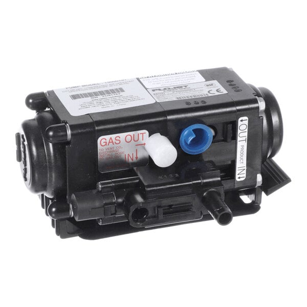 A black mechanical pump component with multiple labeled ports, including 'GAS OUT' and 'PRODUCT IN/OUT,' and various connectors and caps visible.