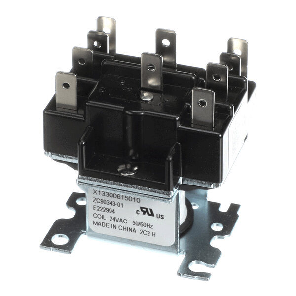 A black and metallic electrical relay with multiple metal terminals and a labeled base.
