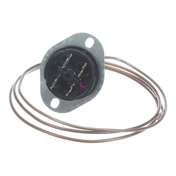 A round metal component with electrical terminals and an attached coiled copper tube.