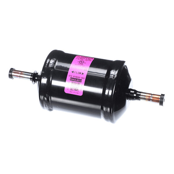 A cylindrical black metal component with two pipe fittings on either end and a pink label in the center.