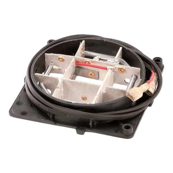 A square-shaped metal and plastic assembly with internal metal dividers, a coiled black cable, and visible screws and connectors.