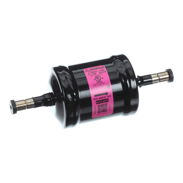 A cylindrical black metal component with a pink label and two metal fittings on either end, likely used in HVAC or refrigeration systems.