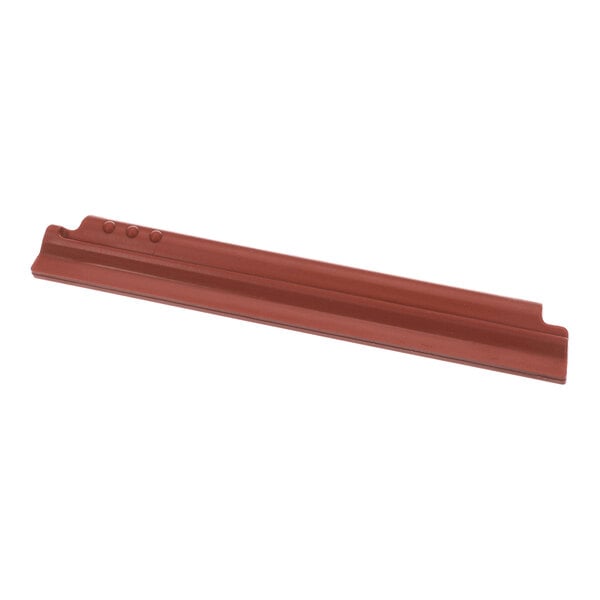 A red, elongated squeegee blade with grooves and three small raised dots on one end.