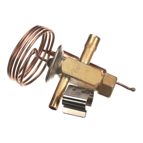 A brass and copper mechanical component with a coiled tube and multiple fittings, likely part of a refrigeration or HVAC system.
