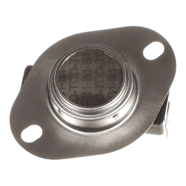 A close-up view of a small metallic component with two mounting holes and a central circular element, likely an electronic or mechanical part.