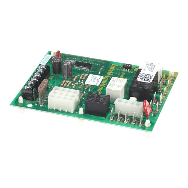 A green electronic circuit board with various components including capacitors, relays, connectors, and resistors mounted on it.