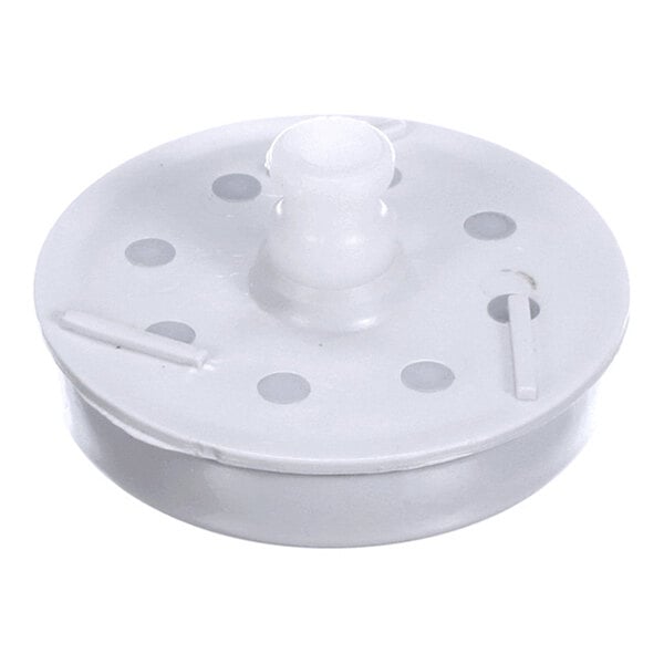 A round, white plastic component with a central raised section and several evenly spaced holes on its surface.