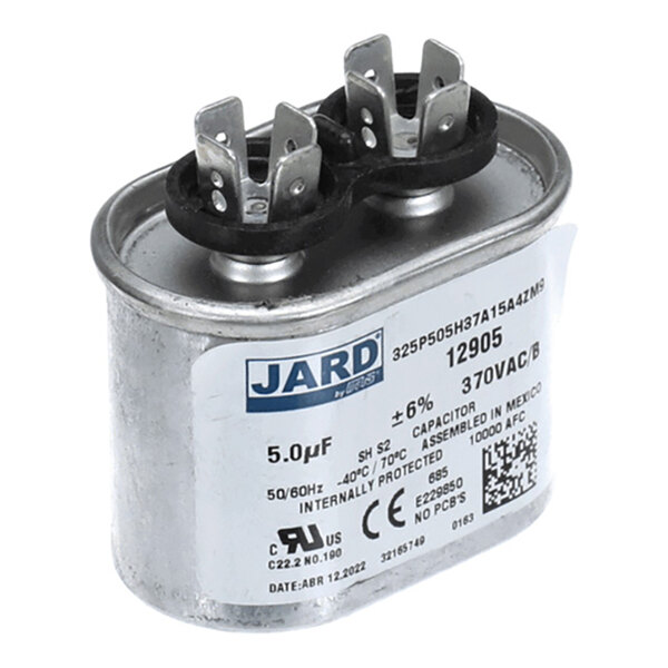 A metal can capacitor with dual terminals and a label displaying specifications such as 5.0µF, 370VAC, and manufacturer information.