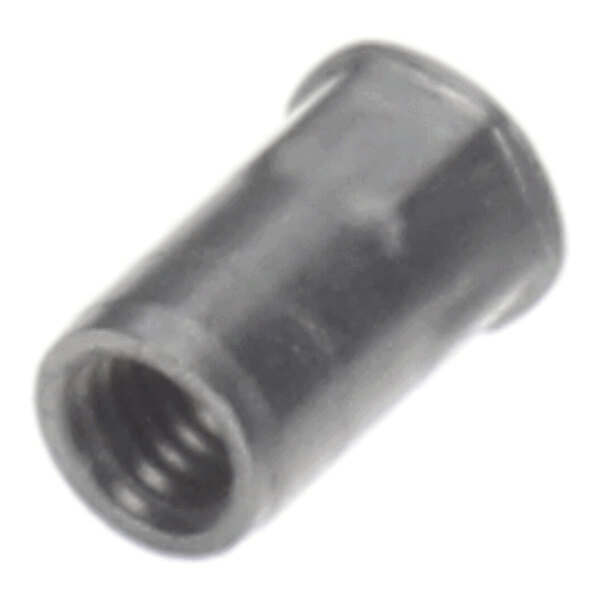 A close-up view of a small, cylindrical metal insert nut with internal threading.