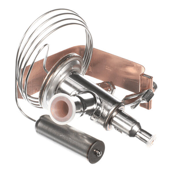 A metallic mechanical component with a coiled tube, cylindrical parts, and a copper strap, likely part of a refrigeration or HVAC system.