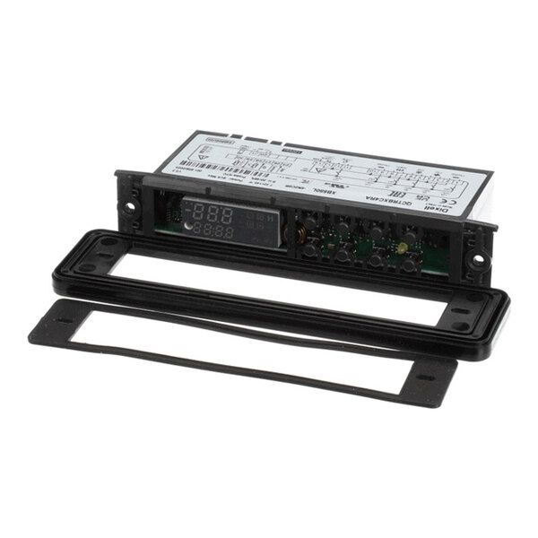 A rectangular electronic device with a digital display, circuit board, and a separate black mounting frame and gasket.