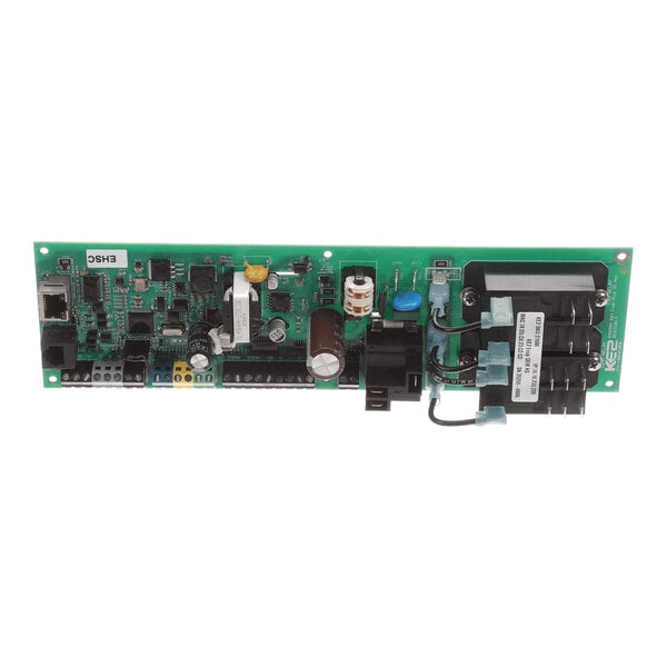 A green electronic circuit board with various components including capacitors, connectors, and a transformer mounted on it.