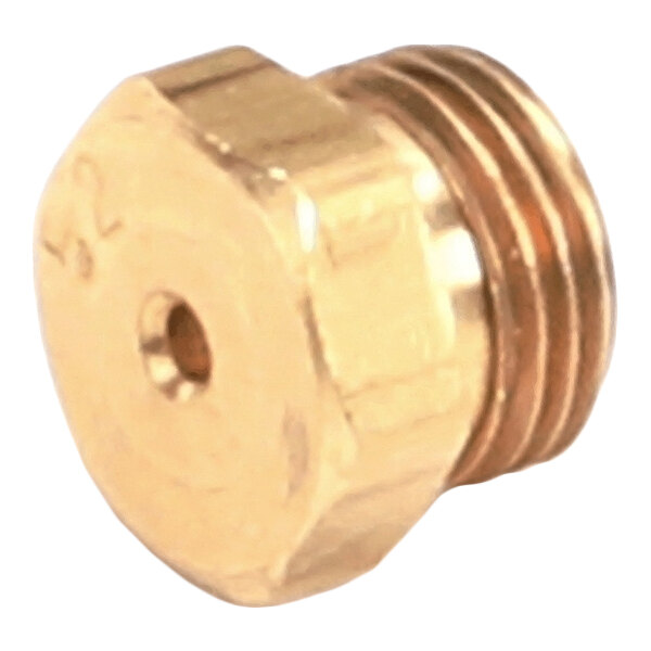 A close-up view of a small, brass, hexagonal threaded component with a central hole.