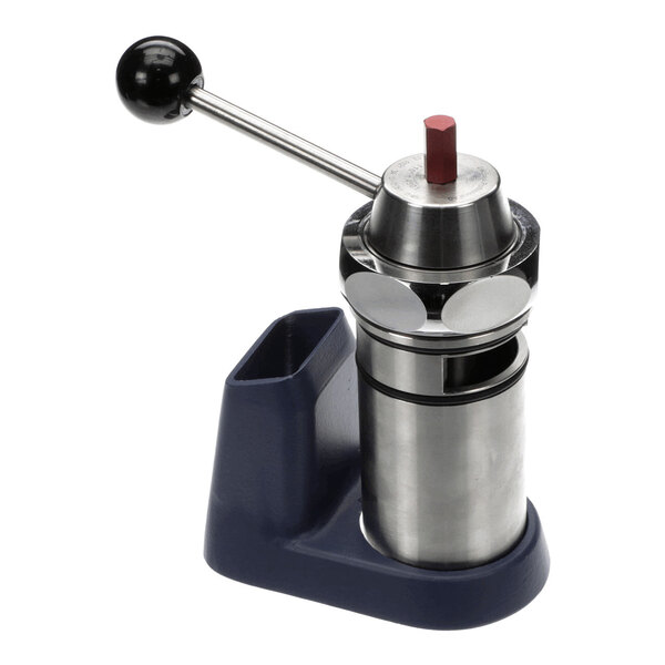 A metal and plastic mechanical device with a lever handle and a cylindrical base, featuring a red-tipped component on top.