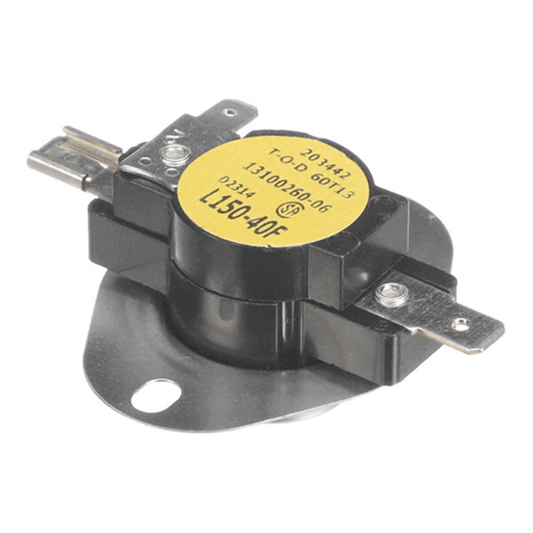 A round, black and metal electronic component with a yellow label and two metal terminals, mounted on a flat metal base with a hole for attachment.