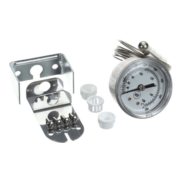 A metal temperature gauge with a dial, a metal mounting bracket, several small white plastic components, and a set of metal calibration keys.