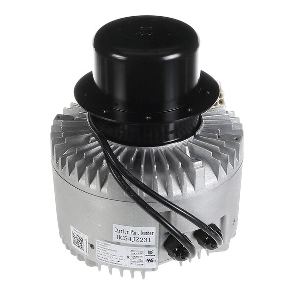 A cylindrical metallic motor with a finned exterior, black top cover, and attached electrical wires.