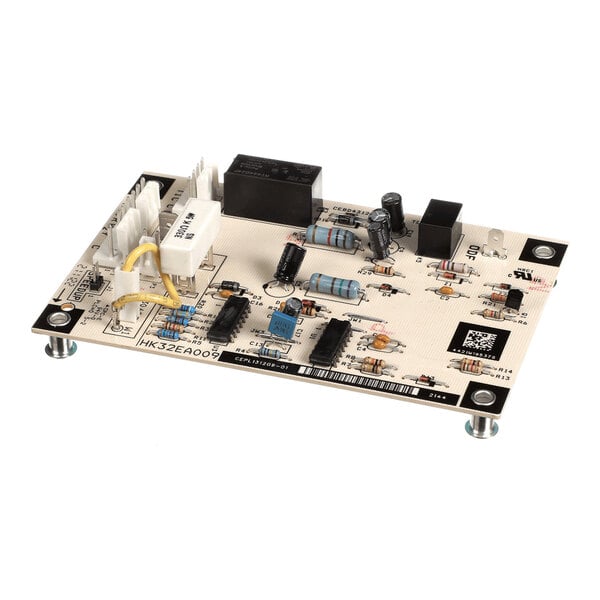A rectangular electronic circuit board with various components such as resistors, capacitors, relays, and connectors mounted on it, supported by four metal standoffs.