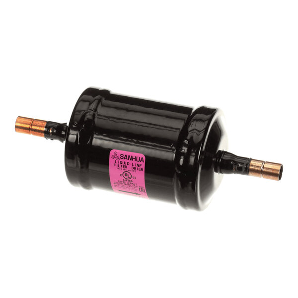 A black cylindrical component with copper fittings on both ends and a pink label in the center.