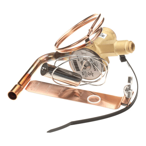 A metallic valve assembly with attached copper tubing, a coiled sensor line, and mounting hardware.