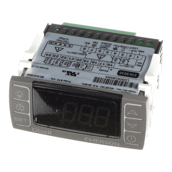 A digital electronic control unit with a display screen, labeled buttons, and wiring diagram on top.