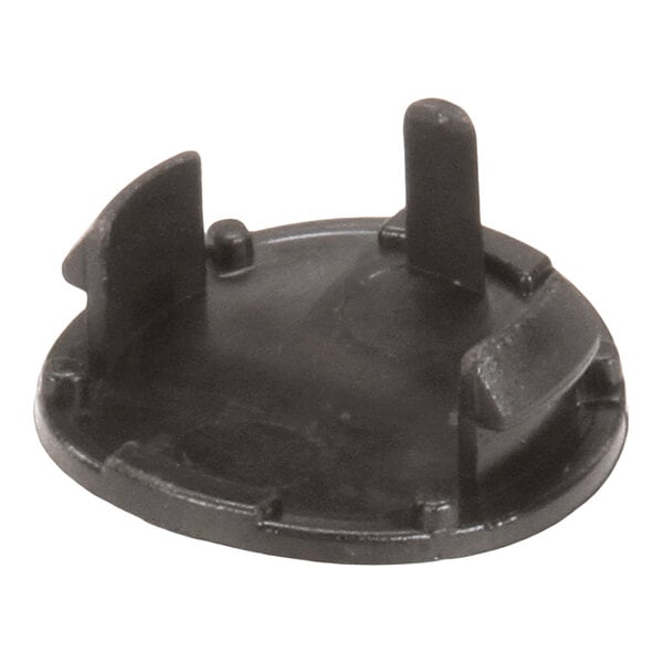 A round black plastic component with several upright tabs and a raised edge, likely a plug or cap for a specific fitting.