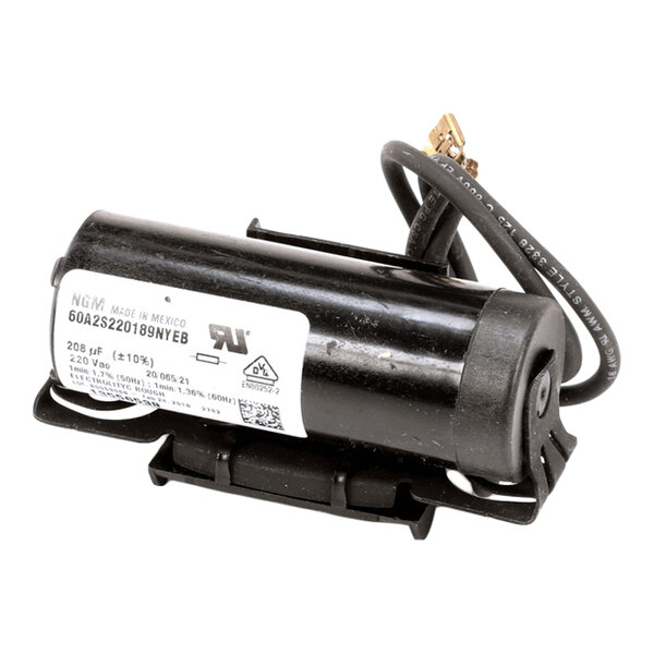 A cylindrical black electrical component with attached wires and a label, likely a capacitor.