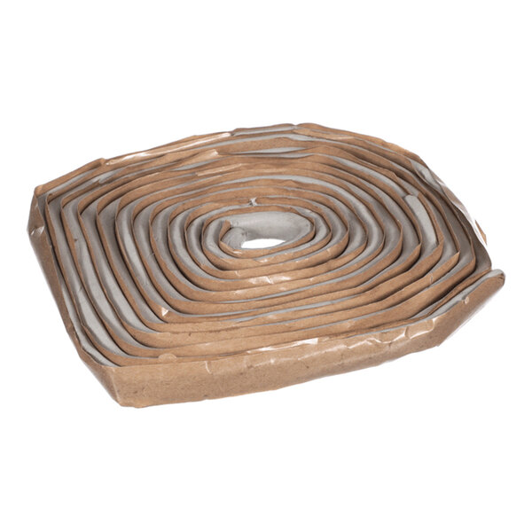 A coiled length of gray rope-like sealing compound with a brown paper backing.
