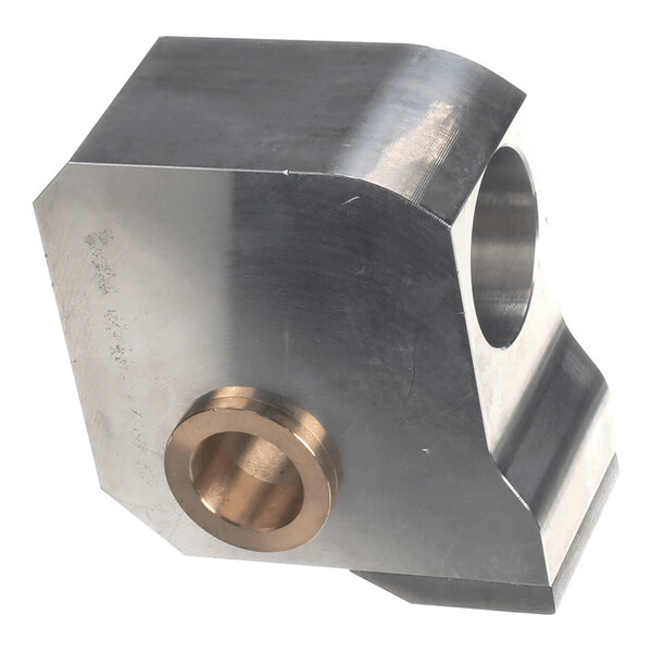 A metallic, angular component with a cylindrical bronze insert and a large circular hole, likely part of a mechanical assembly.