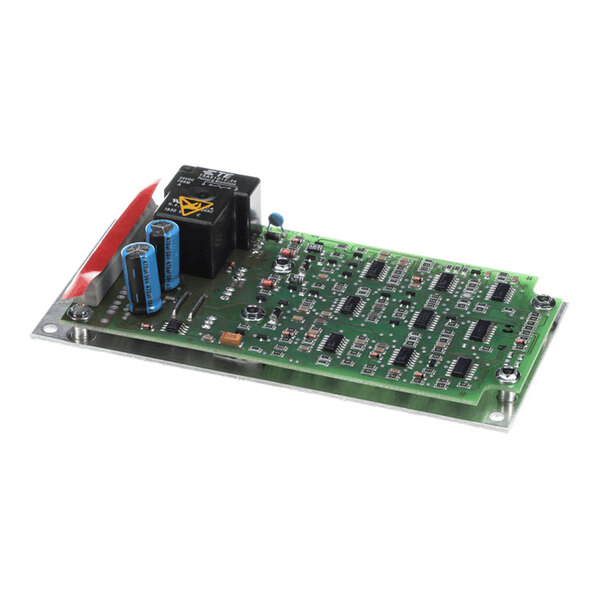 A green printed circuit board (PCB) with various electronic components, including capacitors, relays, and integrated circuits, mounted on a metal base plate.