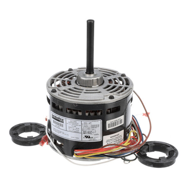 A cylindrical electric motor with a central shaft, multiple colored wires, and two black mounting rings placed nearby.