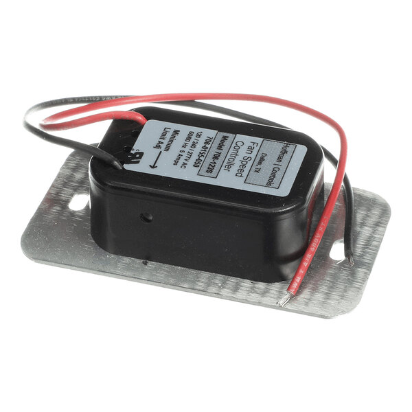 A rectangular black electronic component with two red and two black wires attached, mounted on a metal plate with two screw holes.