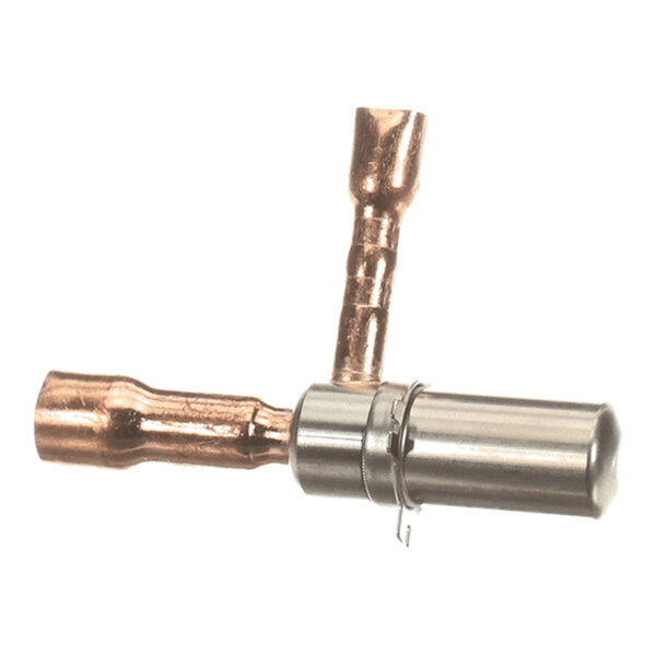 A small metallic component with two copper tubes and a cylindrical silver section, likely part of a refrigeration or HVAC system.