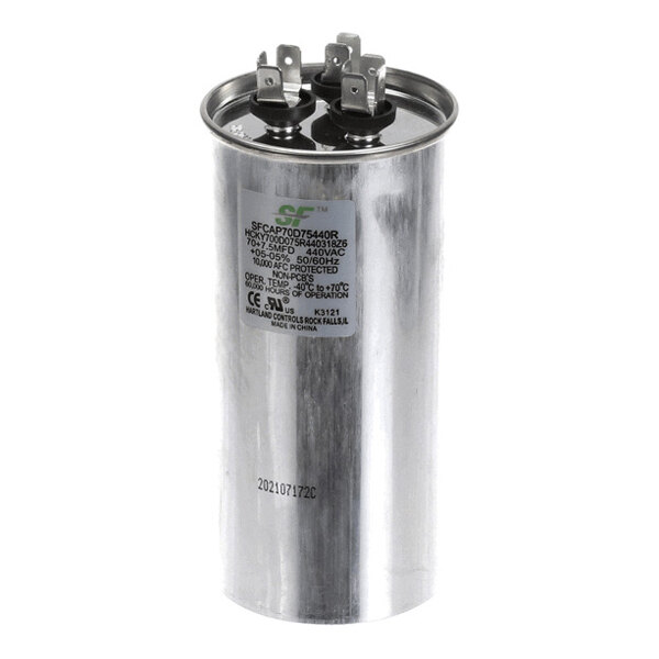 A cylindrical metallic capacitor with three electrical terminals on top and printed specifications on the side.