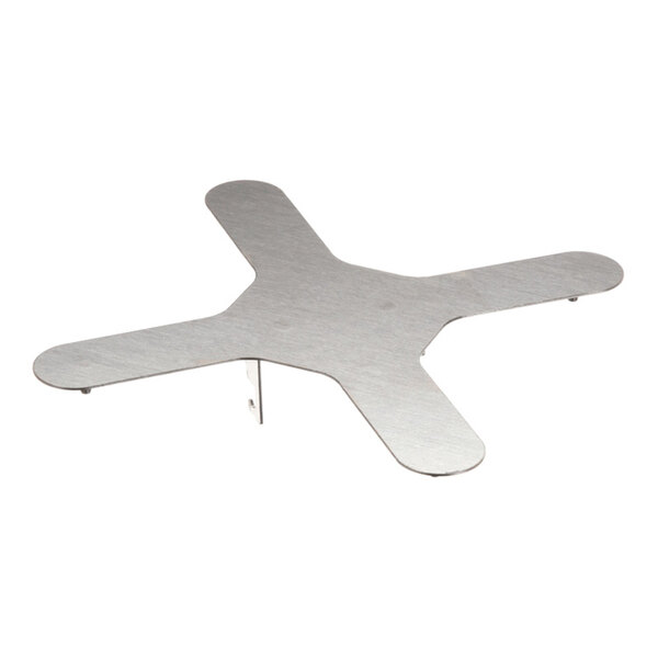 A flat, metallic, cross-shaped object with four rounded arms and a brushed finish, elevated slightly above the surface by small supports.