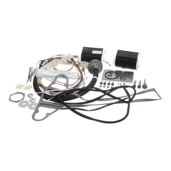 A collection of various mechanical and electrical components, including wires, coils, gaskets, screws, washers, and metal brackets, arranged on a white background.