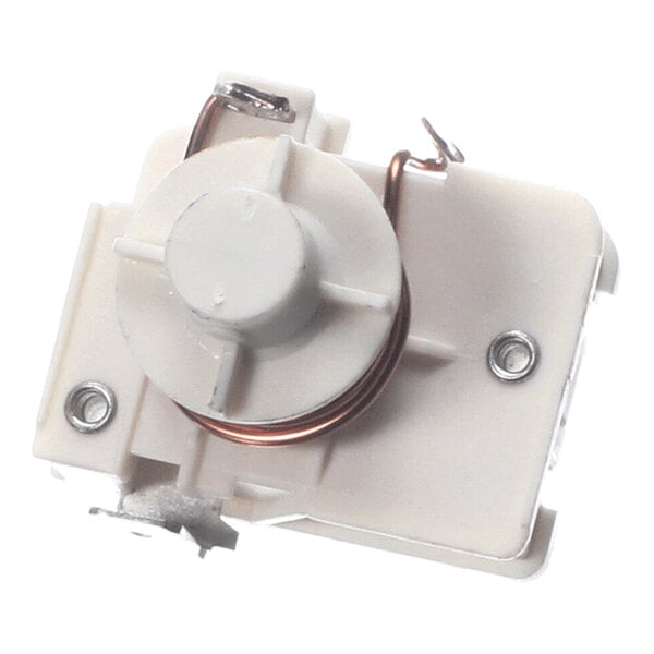 A white plastic component with a circular knob, metal coil, and two visible screws on its surface.