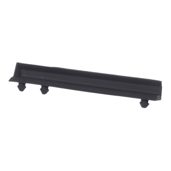 A black, rectangular plastic component with three protruding pegs on the bottom side, likely used as a mounting or drainage part.
