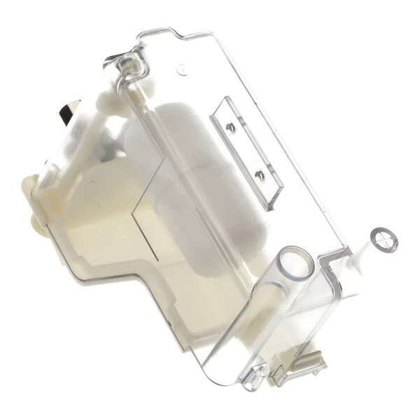 A transparent, irregularly shaped plastic container with various molded sections and openings, likely a reservoir component.