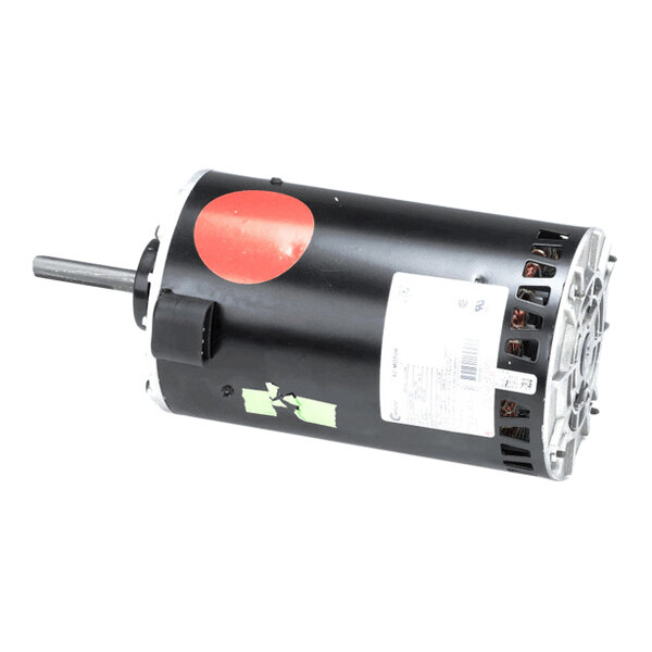 A cylindrical electric motor with a black housing, visible shaft, and attached labels and stickers.