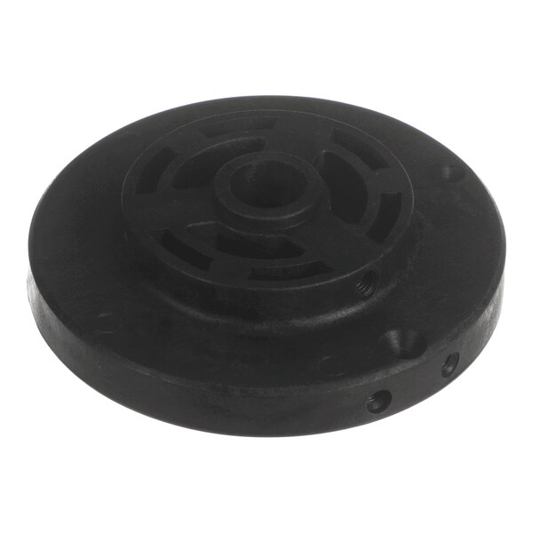 A round, black, flat mechanical component with a central hole and several curved cutouts arranged in a circular pattern.