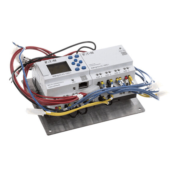 A mounted electronic control module with multiple colored wires connected to terminals and a digital display on one unit.