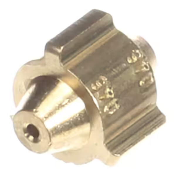 A close-up view of a small, metallic, brass-colored component with a central hole and engraved markings on its cylindrical body.
