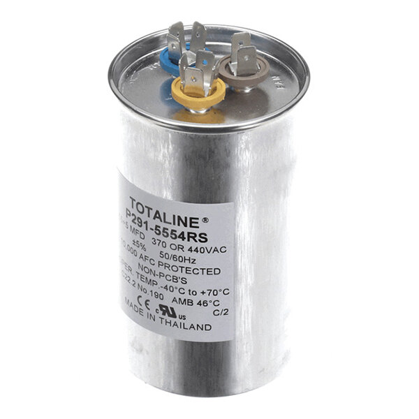 A cylindrical metal capacitor with three color-coded terminals on top and a label displaying technical specifications.