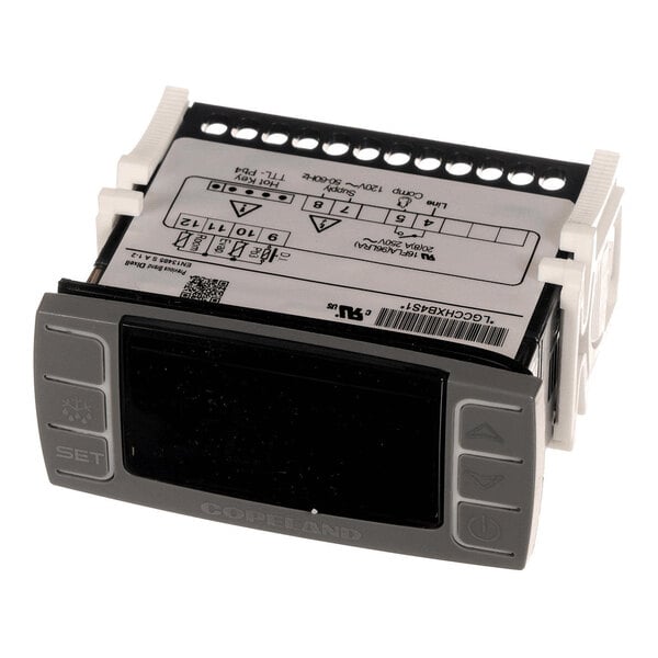 A digital thermostat controller with a display screen and several buttons, featuring labeled connection terminals on the top.