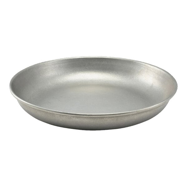 A round, shallow, metallic plate with a smooth surface and slightly raised edges.