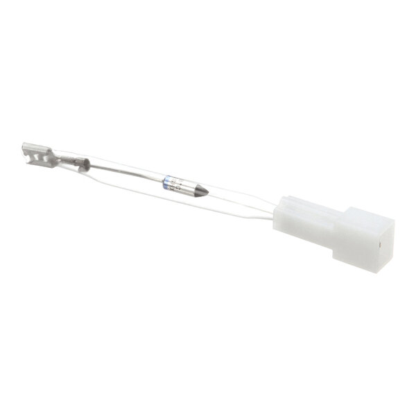 A small electronic component with a white plastic connector, thin wires, and a cylindrical fuse element.